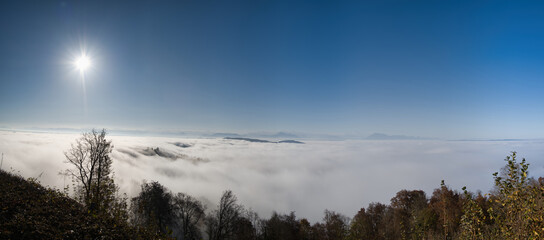Panorama of the sea of ​​fog on the Uetliberg with blue sky in autumn
