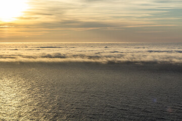 Midnight sun at the North Cape, with clouds over the northern sea