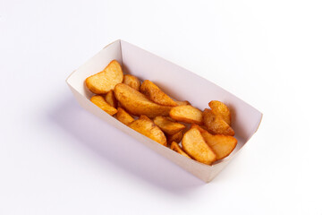 The potatoes are in wedges in the package. On a white background.
