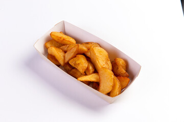 The potatoes are in wedges in the package. On a white background.