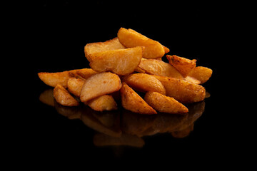 Potato slices lie on a black background.