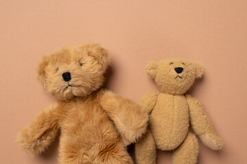 Soft toy bears on a beige background