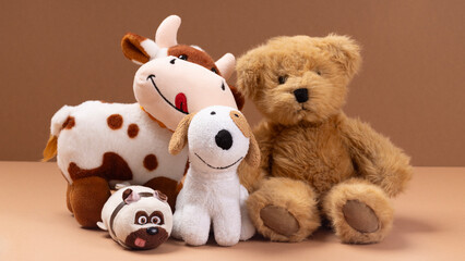 Soft toys on beige background concept of friends