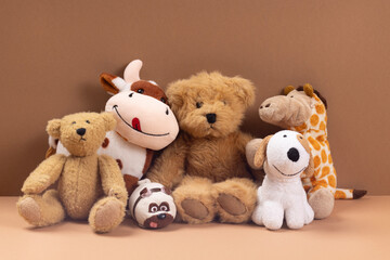 Soft toys on beige background concept of friends