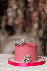Pink birthday cake with silver balls