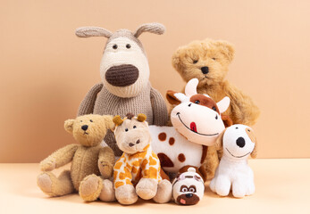 Soft toys on beige background concept of friends