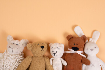 Soft toys on beige background concept of friends.