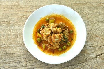 spicy fried pork soft bone with curry and eggplant on plate 