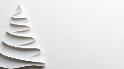 White Christmas tree is drawn on a white background. The tree is made of paper and has a unique, wavy shape. The background is also white, giving the image a clean and simple look