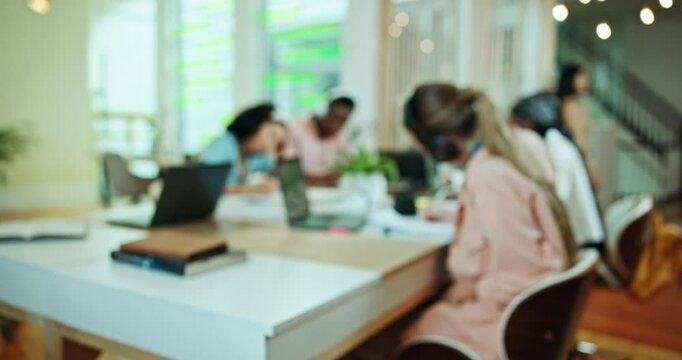 School, students and blur of people in library with laptop for research for assignment, project and online test. College, university and men and women on computer for learning, education and studying