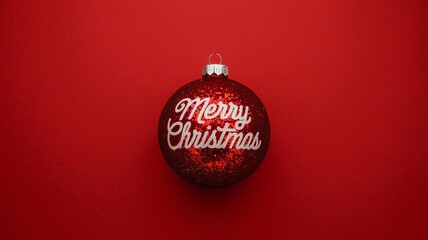 Red Christmas Ornament with Merry Christmas Text on Red Background