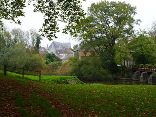 Obraz premium A small park in the countryside with a French city in the background. Guémené-Penfao, France - October 31, 2024. 