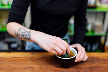 Barista woman hand preparing coffee