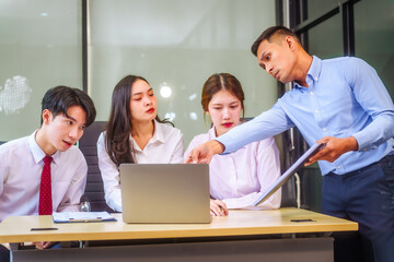 Two men and two women, including boss and employees, discuss recent mistake. Expressions of...