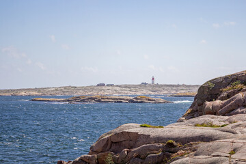 scissor islands off sm&ouml;gen in sweden, with bright sunshine and small white clouds