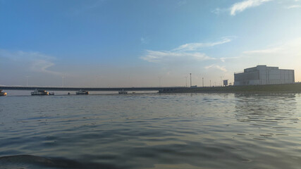 view of Mantra PIK buildings and bridges from the waters of the Kamal Sea