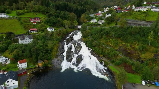 Hellesylt, Norway, a waterfall near the town, drone shot, aerial video