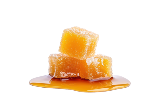 Explore the visual appeal of melting sugar cubes in syrup on white background