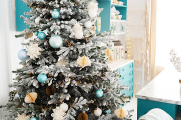 Cozy living room with a blue-and-white decorated Christmas tree