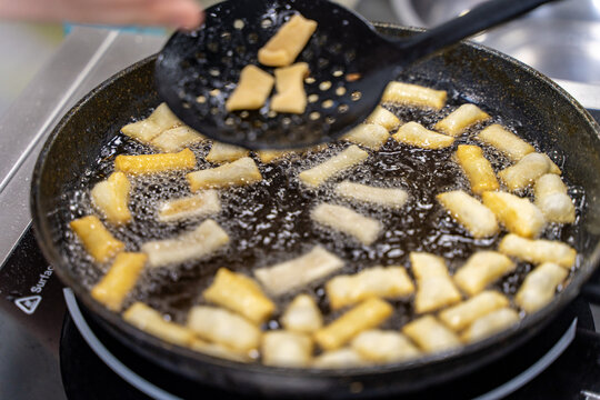 The dough is fried in pieces in a pan in oil (Pa Thong Ko), Baursaks or chak chak is a traditional national dish.