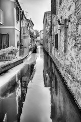 Walking among the picturesque canals of Comacchio, Italy