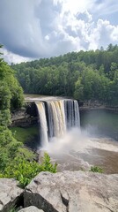 Fototapeta premium Cumberland Falls cascading majestically amidst lush greenery on a sunny day