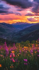 Fototapeta premium A stunning sunset view over Vail Valley adorned with vibrant wildflowers and majestic mountains