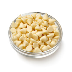Glass bowl with white chocolate chips close up isolated  on white background