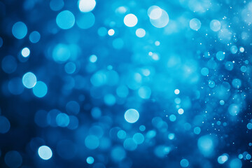 Bright blue bokeh background with defocused lights creating a festive, dreamy, and elegant visual, perfect for holiday or winter themes.