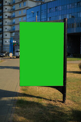 Advertising billboard along the road in the city on a winter day. Background for design. 