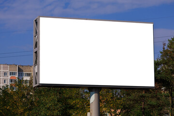 Background for design, white billboards on city streets and along roads in the summer day