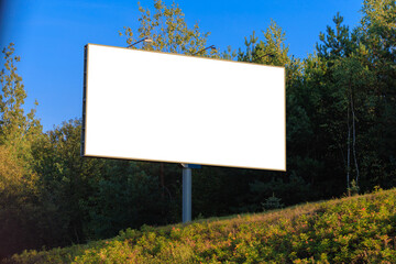 Background for design, white billboards on city streets and along roads in the summer day