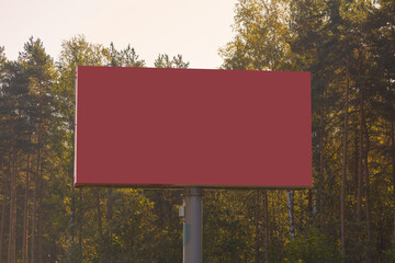 Advertising billboard along the road in the city on a winter day. Background for design. 