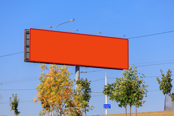 Advertising billboard along the road in the city on a winter day. Background for design. 
