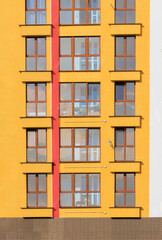 Fototapeta premium Texture of modern buildings, background for design. Elements of architectural decorations of buildings, modern windows, walls and balconies.