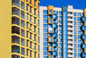 Fototapeta premium City view, modern buildings and skyscrapers against the blue sky.