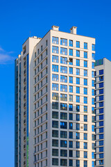 City view, modern buildings and skyscrapers against the blue sky.