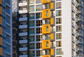 Obraz premium Texture of modern buildings, background for design. Elements of architectural decorations of buildings, modern windows, walls and balconies.