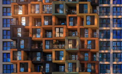 City view on a sunny day. Modern buildings, walls and windows. 
