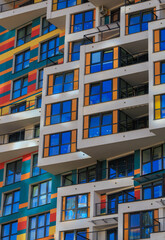City view on a sunny day. Modern buildings, walls and windows. 
