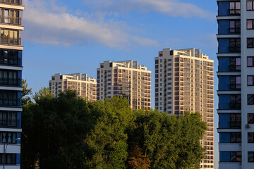 Naklejka premium City view, modern buildings and skyscrapers against the blue sky.
