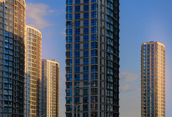 City view, modern buildings and skyscrapers against the blue sky.