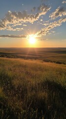 Fototapeta premium A sunset illuminating vast grassy plains with vibrant clouds stretching across the horizon at dusk