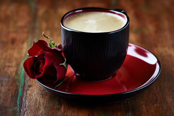 Cup of coffee on wooden background. Close up