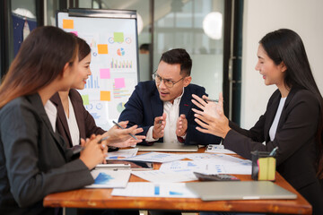 Group of Asian businessmen Sitting in meetings, talking, exchanging knowledge, presenting work.