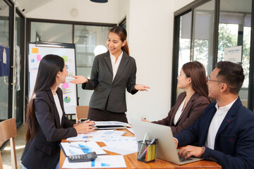 Group of Asian businessmen Sitting in meetings, talking, exchanging knowledge, presenting work.