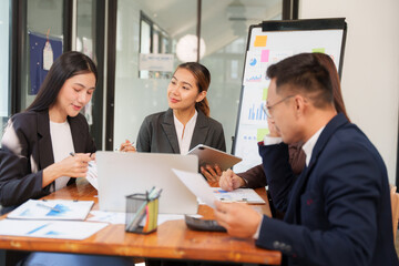 Group of Asian businessmen Sitting in meetings, talking, exchanging knowledge, presenting work.