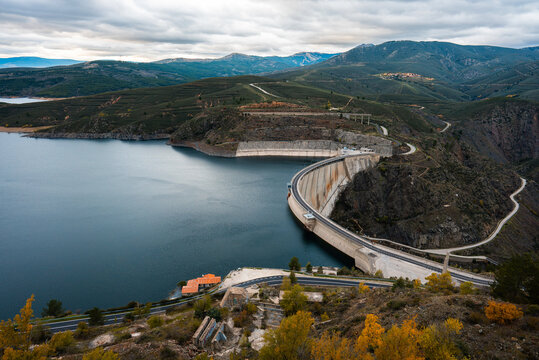 concrete dam reservoir on river with artificial lake, El Atazar embalse by Madrid, aerial drone view
