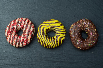 Sweet glazed colorful donuts . Top view