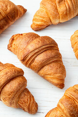 Group of sweet croissant . French morning breakfast . Top view